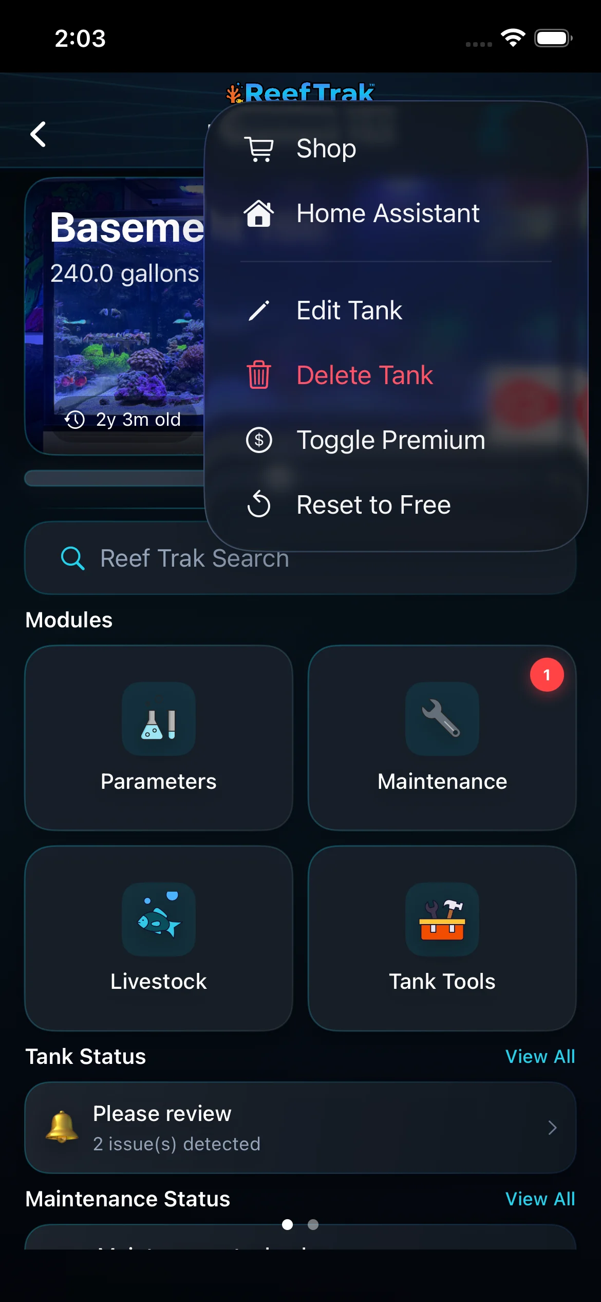 Reef Trak tank dashboard on iPhone with the More menu open and Edit Tank visible above the modules
