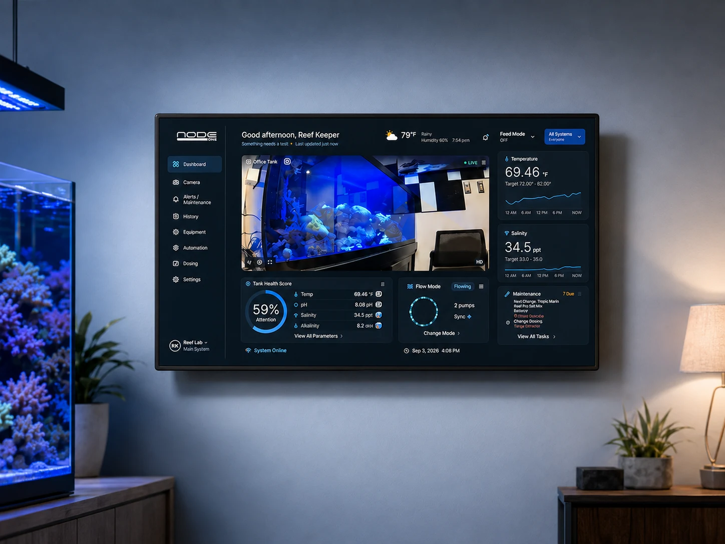 Wall-mounted Node ONE Dolphin showing its aquarium dashboard beside a reef tank
